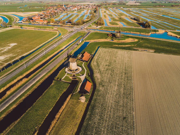 istock High Angle View Of Windmills In Agricultural Field 1320455409