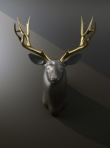 istock deer head with golden antlers on the wall 1320456204