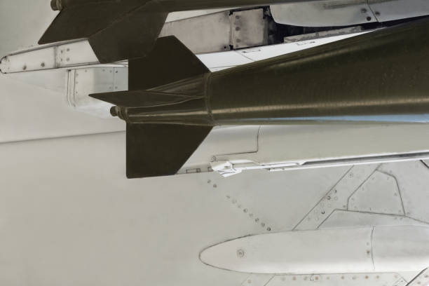 istock Bomb and missile on a fighter bomber jet plane. Aircraft armament. 1320458580