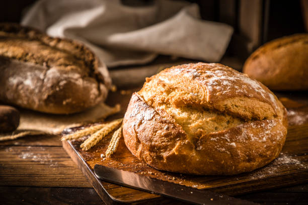 Loaf of bread on a rustic wooden table