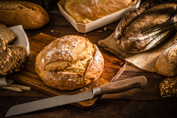 istock Various types of bread on a rustic wooden background 1320460039