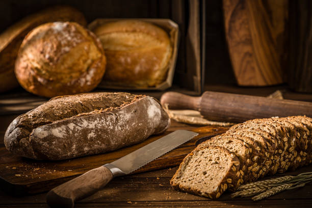 Various types of bread on a rustic wooden table