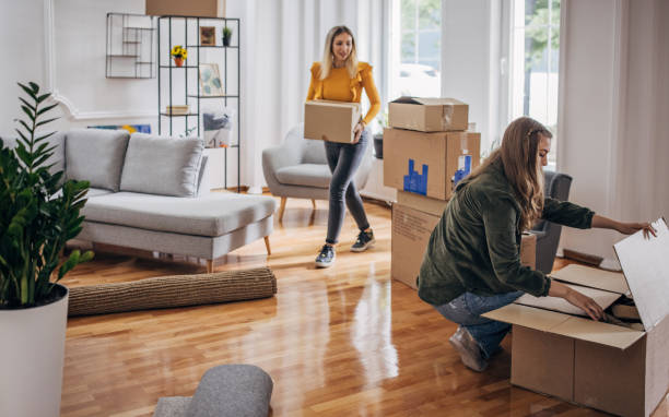 istock Lesbian couple unpacking in new home 1320462845