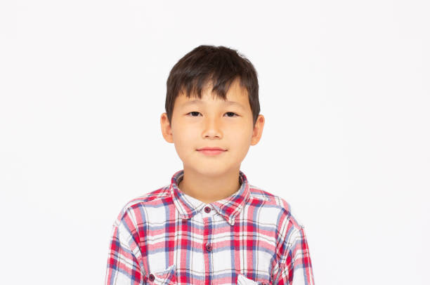 istock Portrait of young Asian boy smiling. 1320467103