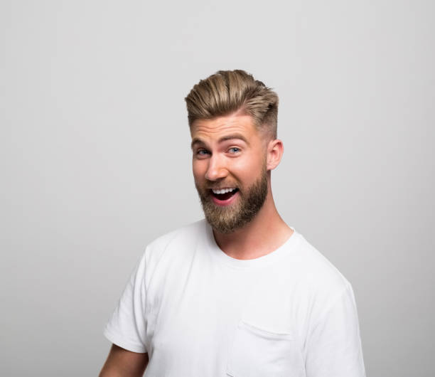 istock Headshot of excited young man 1320467775