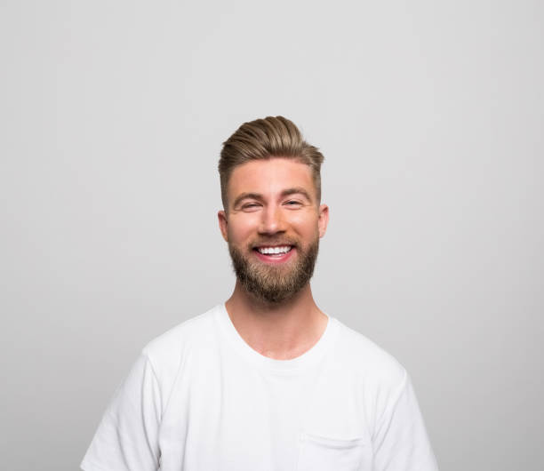 istock Headshot of happy young man 1320467838