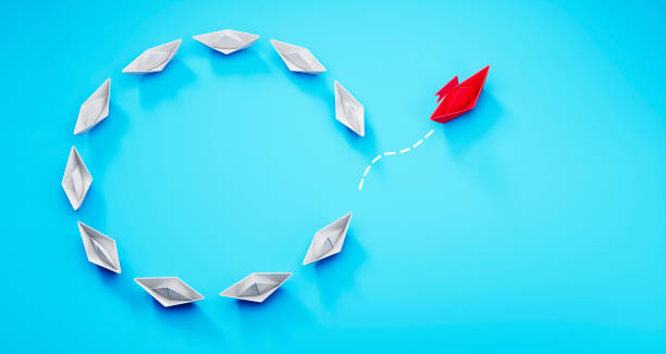 istock Paper boats - Thinking concept differently - Changing course - new ideas 1320468796