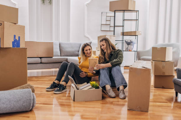 istock Lesbian couple unpacking in new home 1320469019