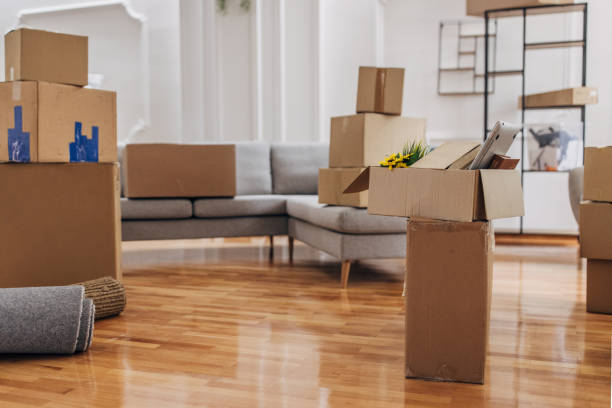 istock Cardboard boxes in new home 1320470070