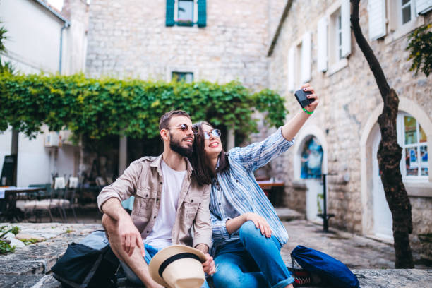 istock Couple on holiday in Budva making selfie 1320470736