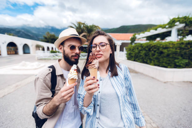 istock Couple eating ice cream on vacation 1320471307