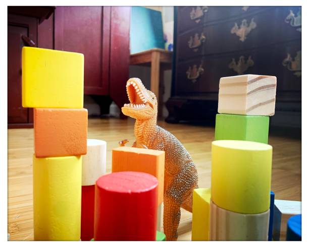 istock Toy Dinosaur and Wooden Blocks 1320472680