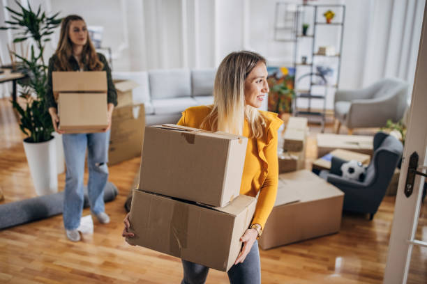 istock Lesbian couple moving in new home 1320472899