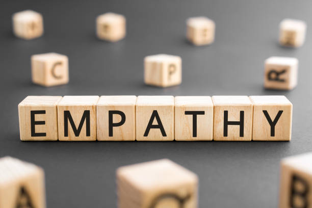Empathy - word from wooden blocks with letters Empathy concept, random letters around black background empathy stock pictures, royalty-free photos & images