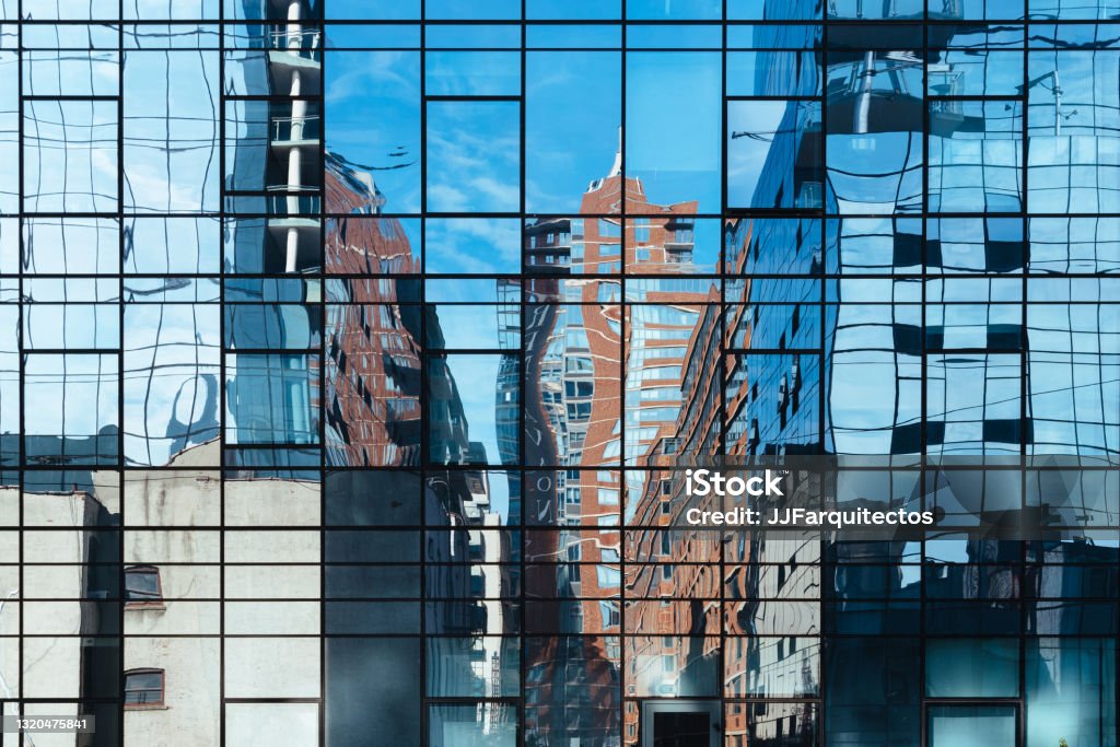 Reflections in the curtain wall of an office building Reflections in the curtain wall of an office building. Construction Industry Stock Photo