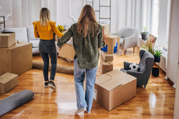 istock Lesbian couple moving in new home 1320479882