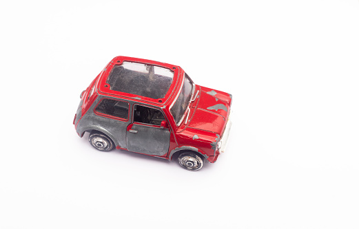 old plastic car isolated on the white background