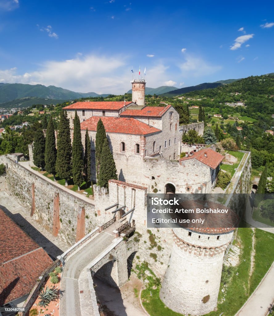Beautiful view from a drone on the architectural complex of the castle in Brescia city (Vertical photo) Brescia - Italy. May 20, 2021: Beautiful view from a drone on the architectural complex of the castle in Brescia city (Vertical photo) Above Stock Photo
