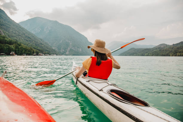 istock Relaxing kayak ride on a calm lake 1320482431
