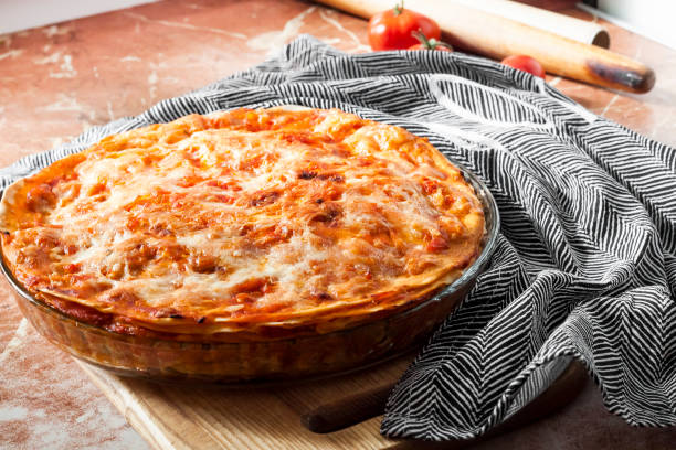 istock Homemade lasagna in round glass baking dish 1320482469
