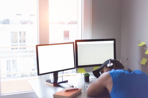 istock businessman with headphones at work 1320483344
