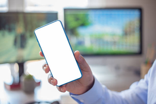 istock Businessman with smartphone. Mobile phone screen mockup. 1320483356