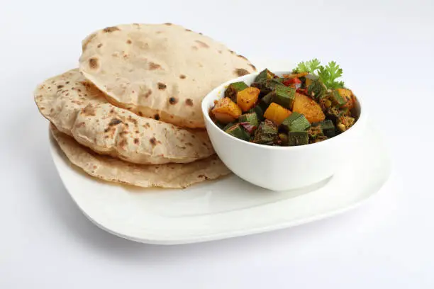 Bhindi masala or ladies finger fry curry with Aloo bhindi or Alu bhindi sabzi home made curry served with indian roti ,chapati or Indian Flat bread