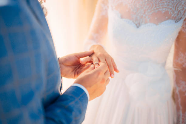 istock Close-Up Of Hand Holding Hands Against Blurred Background 1320487048