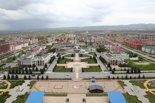 Tashkent, Uzbekistan - May 24, 2021: Aerial view of International Friendship Square in Tashkent city with waving Uzbekistan flag