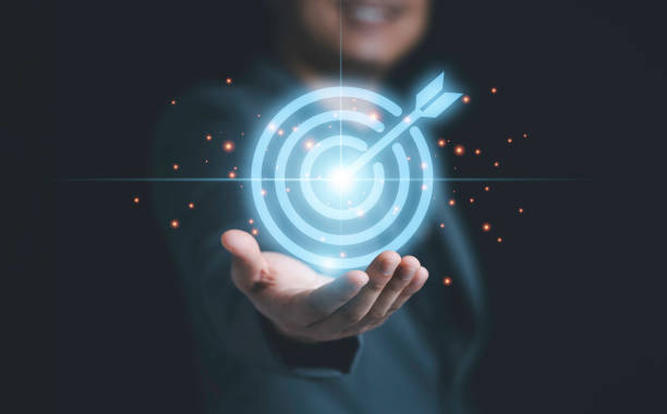 istock Businessman holding virtual blue dartboard with arrow ,Business Achievement objective target concept. 1320488787