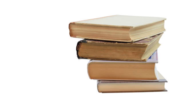 istock Four books laid out in a pile with a slight shift relative to each other 1320488899