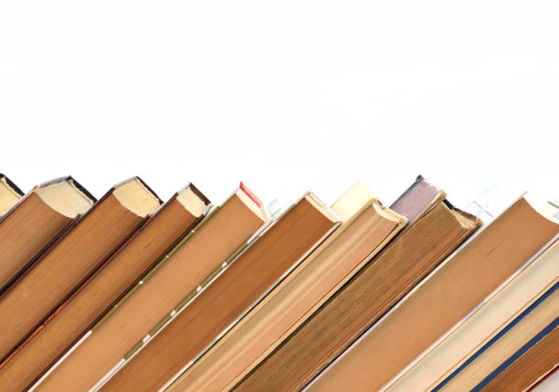 istock Stack of old books on white background, laid out obliquely 1320488926
