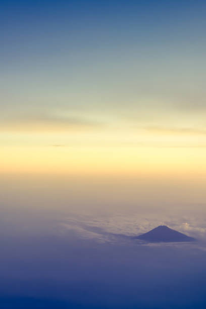 beautiful aerial view on a mountains or volcano from the plane - mountain range earth sky airplane imagens e fotografias de stock