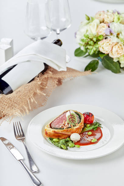 istock Easter meat roll, meatloaf for Easter dinner. Beautifully decorated catering banquet table with different food snacks and appetizers 1320490741