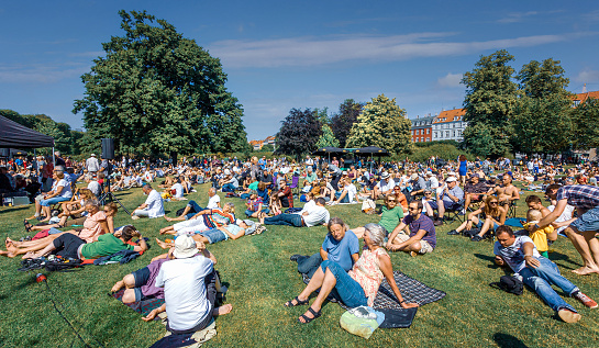 Audience at Kongens Have, The Royal Garden, waiting for a concert to start during the Copenhagen  Jazz festival 2013.