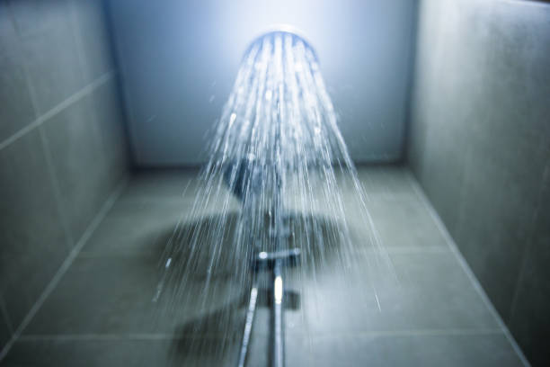 shower head with falling water - locker room locker shower nobody imagens e fotografias de stock