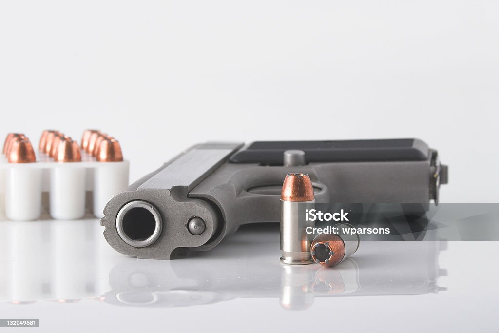 Pistol and bullets Semi automatic handgun and pistol cartridges Ammunition Stock Photo
