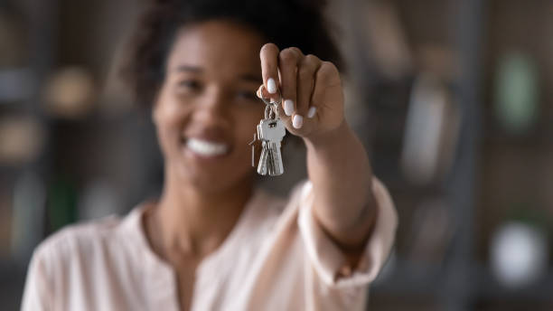 istock Close up focus on keys in female african ethnicity hands. 1320497971