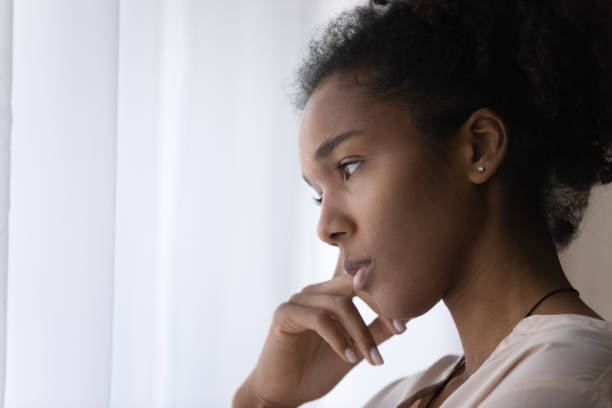 istock Close up pensive african woman thinking of problem solution. 1320497974
