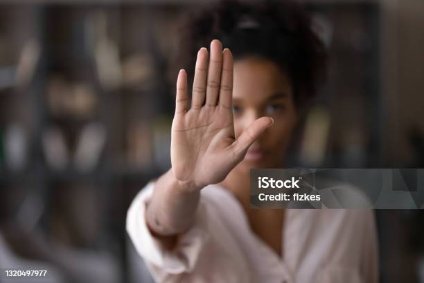 Serious African American Woman Protesting Against Bullying Stock Photo - Download Image Now