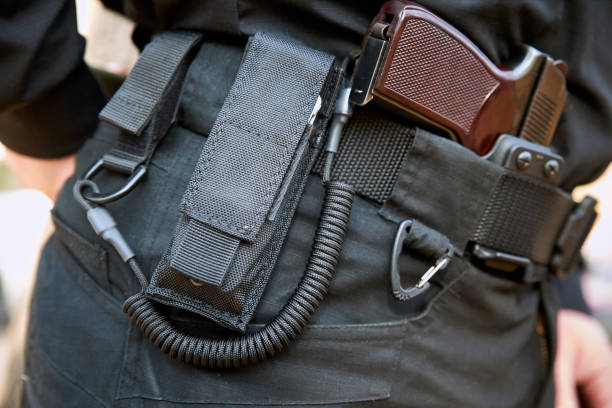 istock Army set on a man?s belt: carbine, pistol, lasso. 1320499405