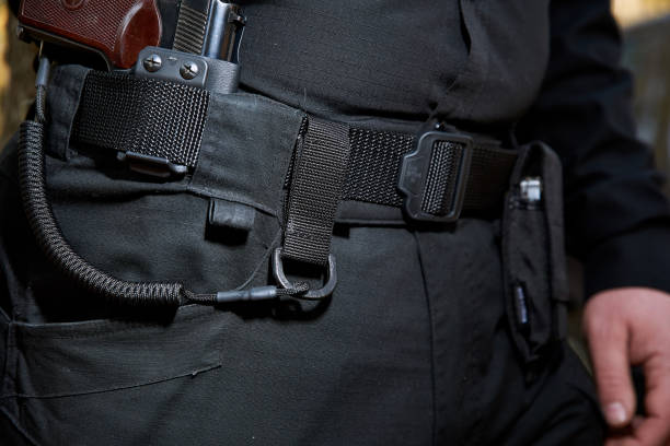 istock Army set on a man?s belt: carbine, pistol, lasso. 1320499408