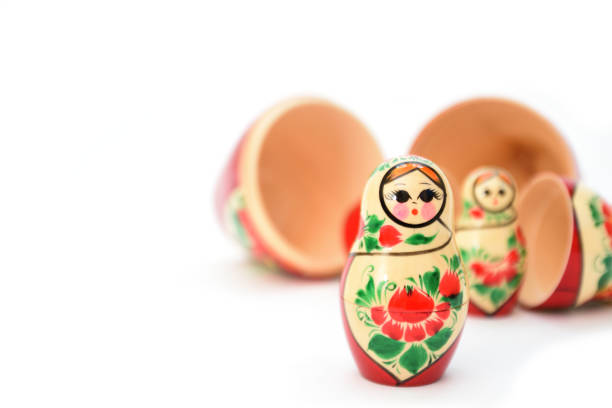 istock One small nesting doll stands in the foreground and several disassembled ones lie in the background 1320500835