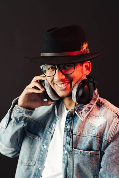 istock Carefree dark skinned guy listens lively music 1320504040