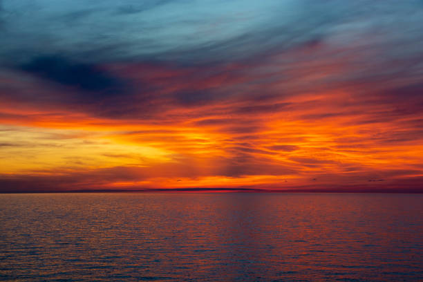 istock The sea at dusk reflecting the sun 1320510412