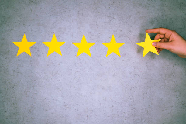 istock Customer Experience Concept. Hand holding five star excellent rating. 1320513186