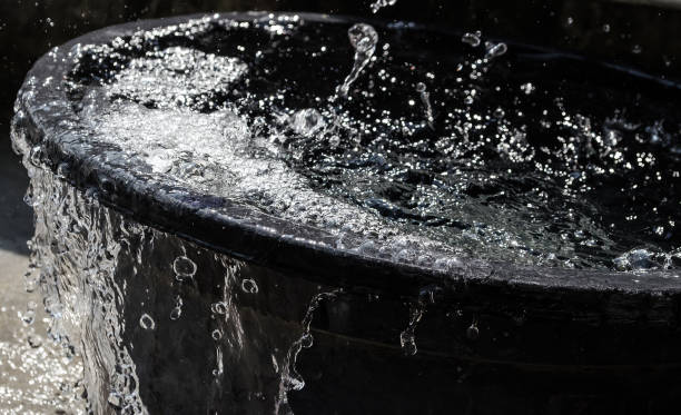 istock splashes and spills water into a black plastic tub 1320514510