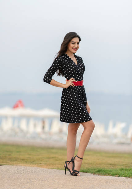 istock Young woman posing near the beach 1320515444