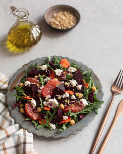 istock Fresh salad with feta cheese, beet, grapefruit, arugula and olive oil 1320516567