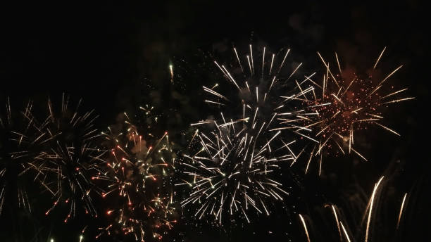 istock Colorful bright fireworks isolated on a black background. 1320516838